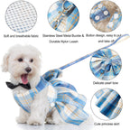 Cute small female dog dress with large decorative bow tie and integrated metal D ring.