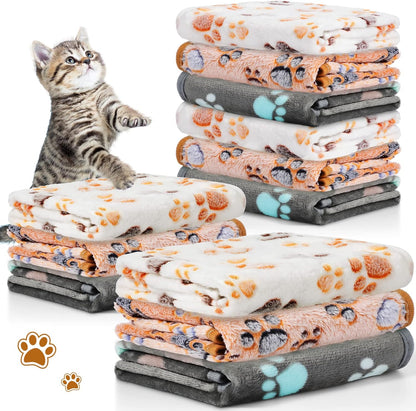 Complete collection of twelve Tegeme paw print small animal blankets displayed together