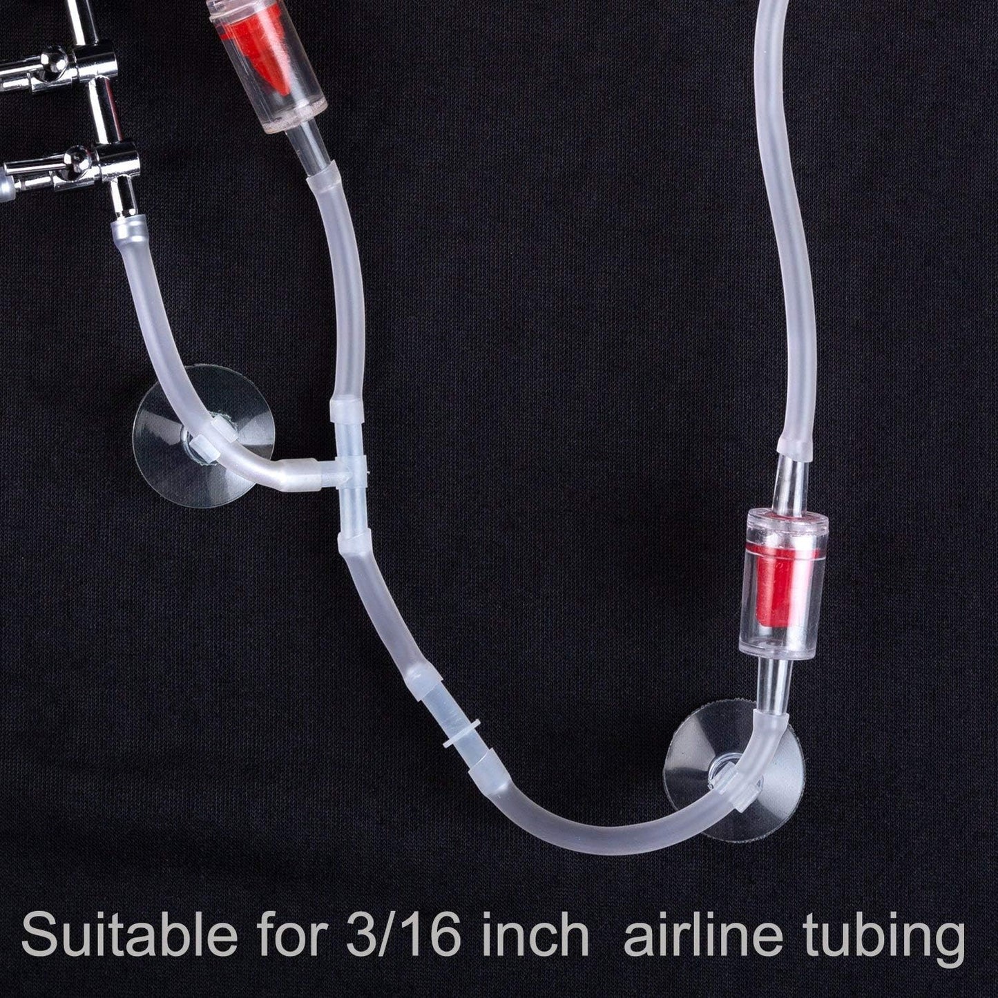 Clear plastic hose holder clamps securing three-sixteenth inch tubing.