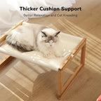 Cat resting on elevated Fukumaru wooden pet couch