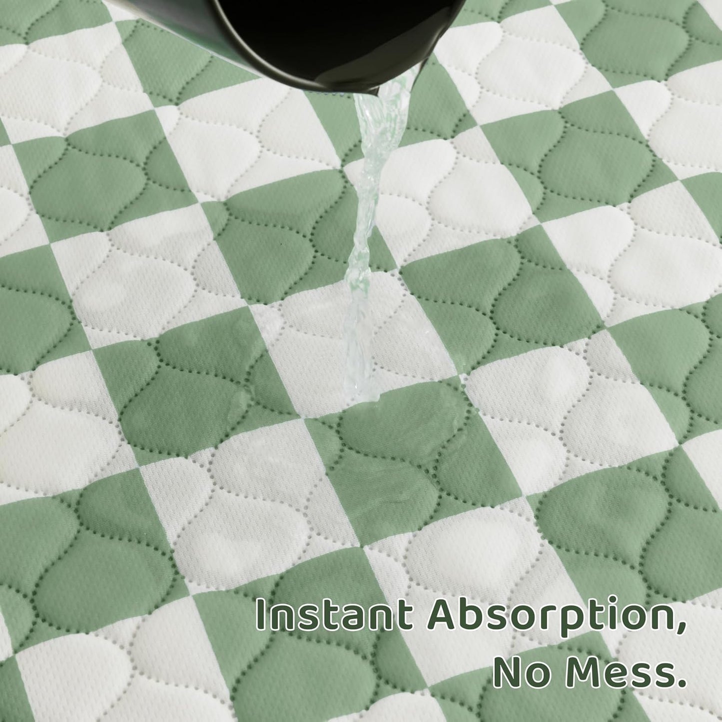 Sage green checkered pee pads inside puppy playpen
