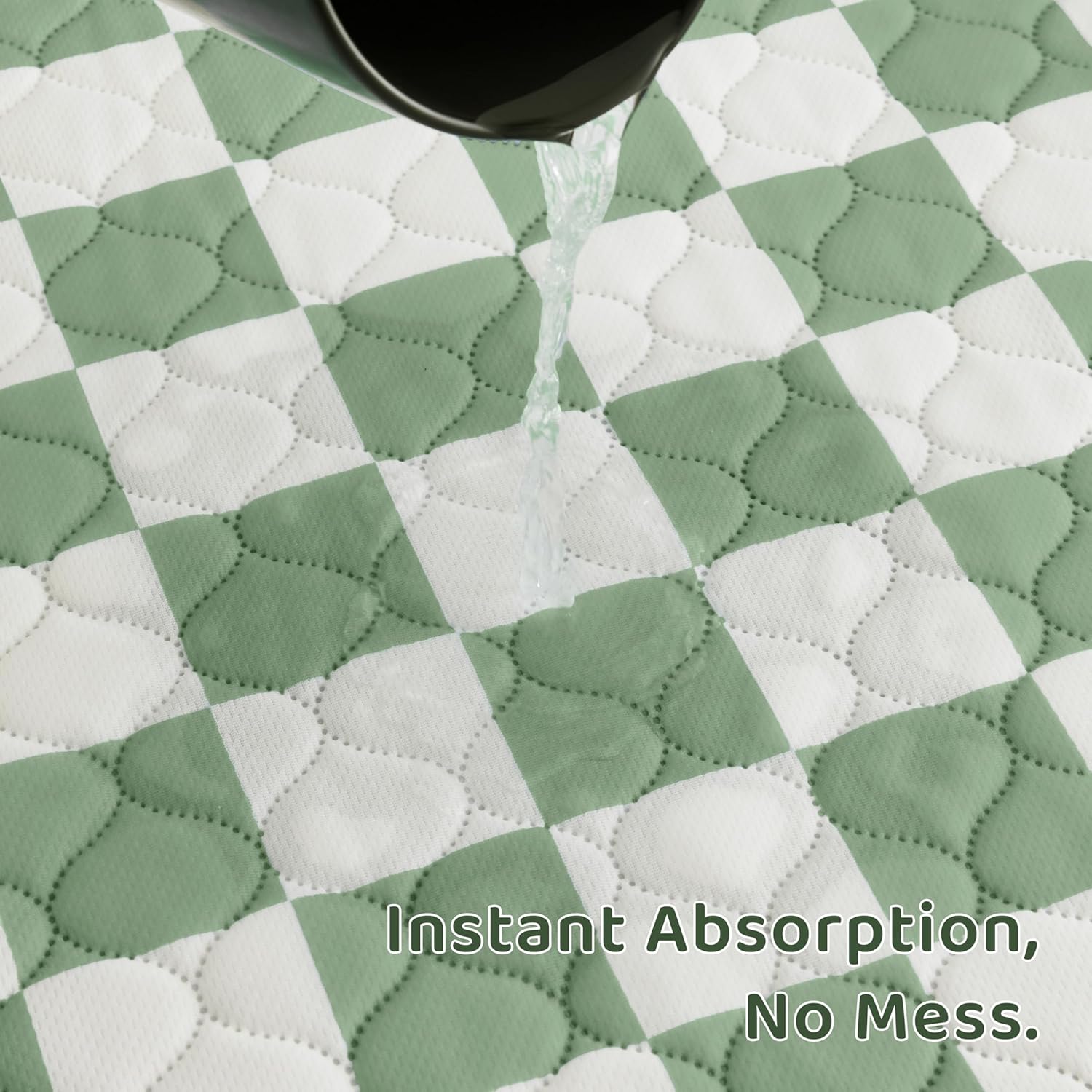 Sage green checkered pee pads inside puppy playpen