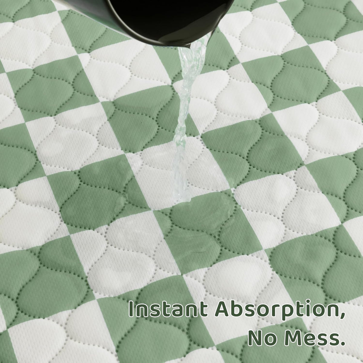 Sage green checkered pee pads inside puppy playpen