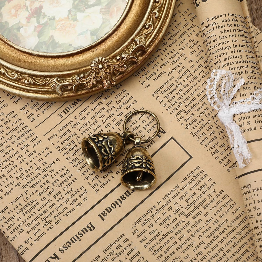 Premium rust resistant brass pet bells displayed with included steel split rings.