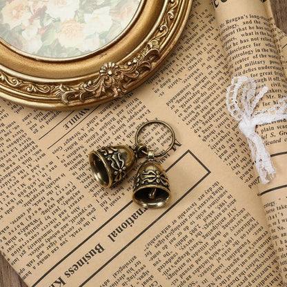 Premium rust resistant brass pet bells displayed with included steel split rings.