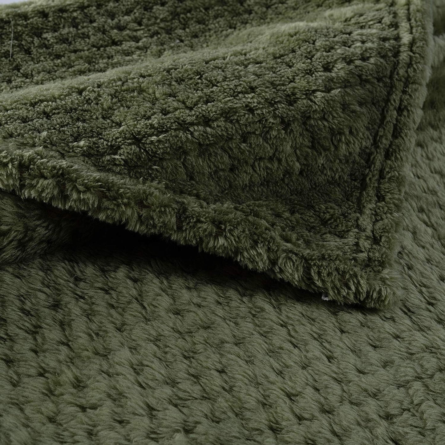 CUTEMATE cozy dog blanket draped neatly over a modern living room couch.