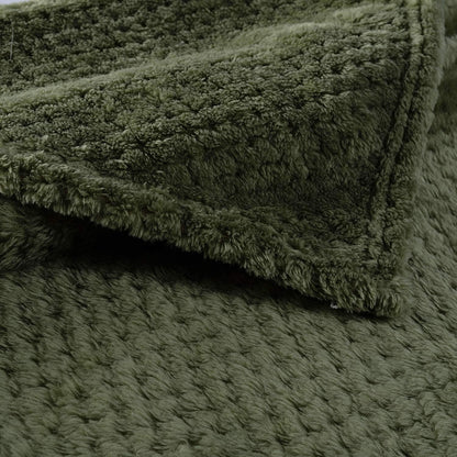 CUTEMATE cozy dog blanket draped neatly over a modern living room couch.