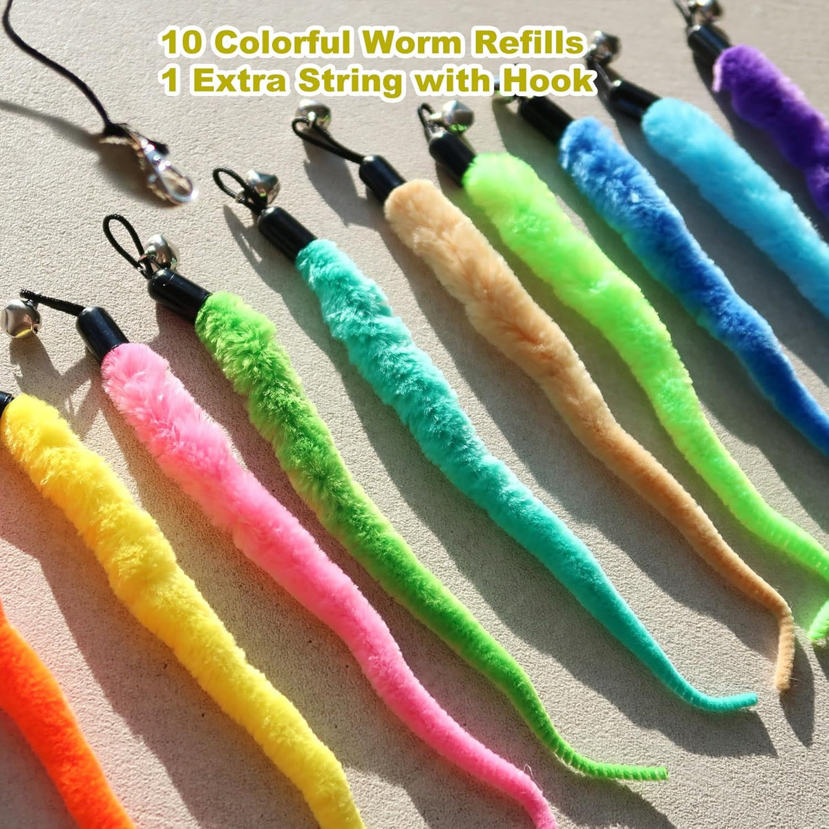 Close-up view of the fuzzy textured faux-fur bodies and attached jingle bells.