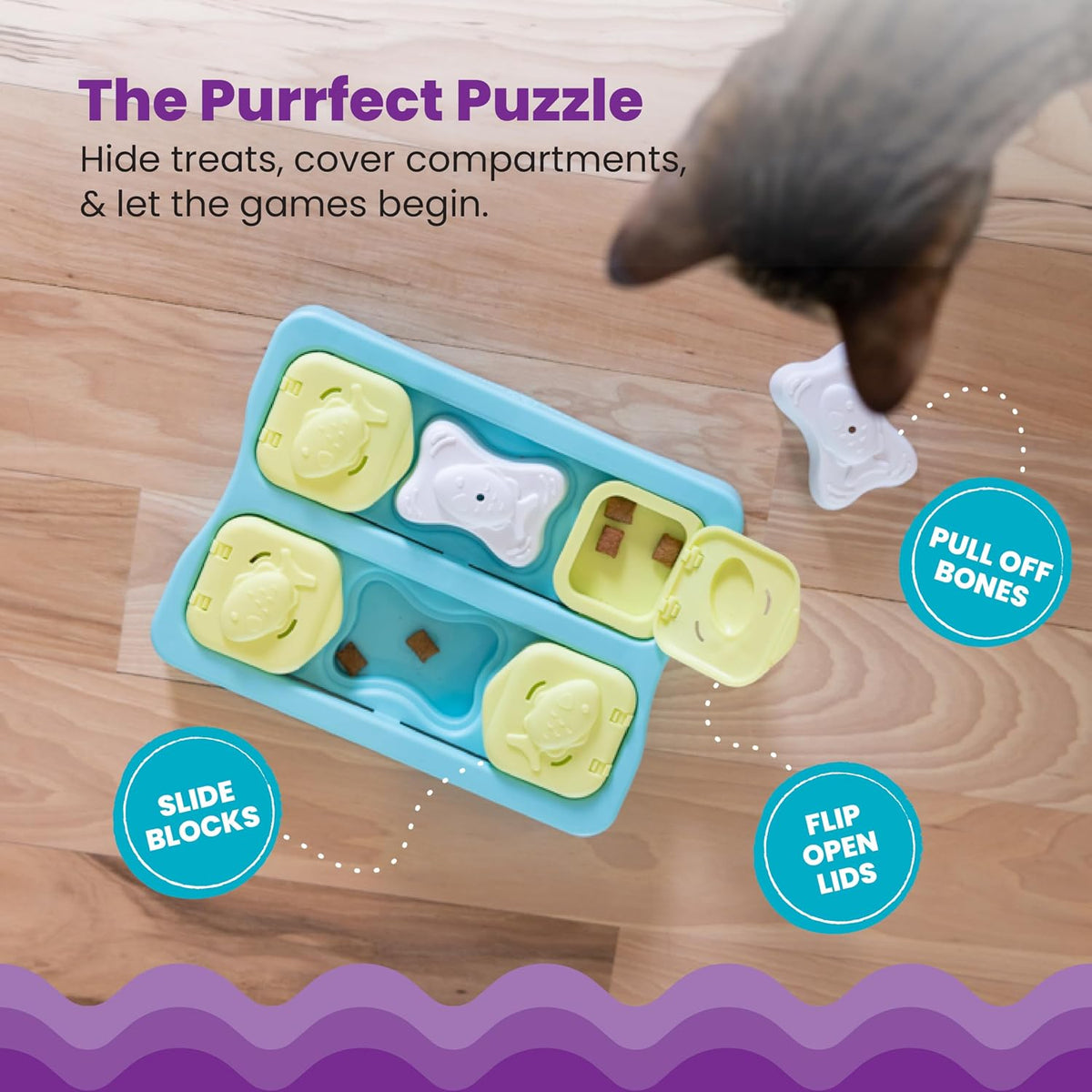 Indoor cat interacting with the blue Catstages Kitty Cube puzzle game