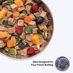 Fresh Frenchie salmon formula for sensitive skin being poured as a healthy meal topper into a dog bowl