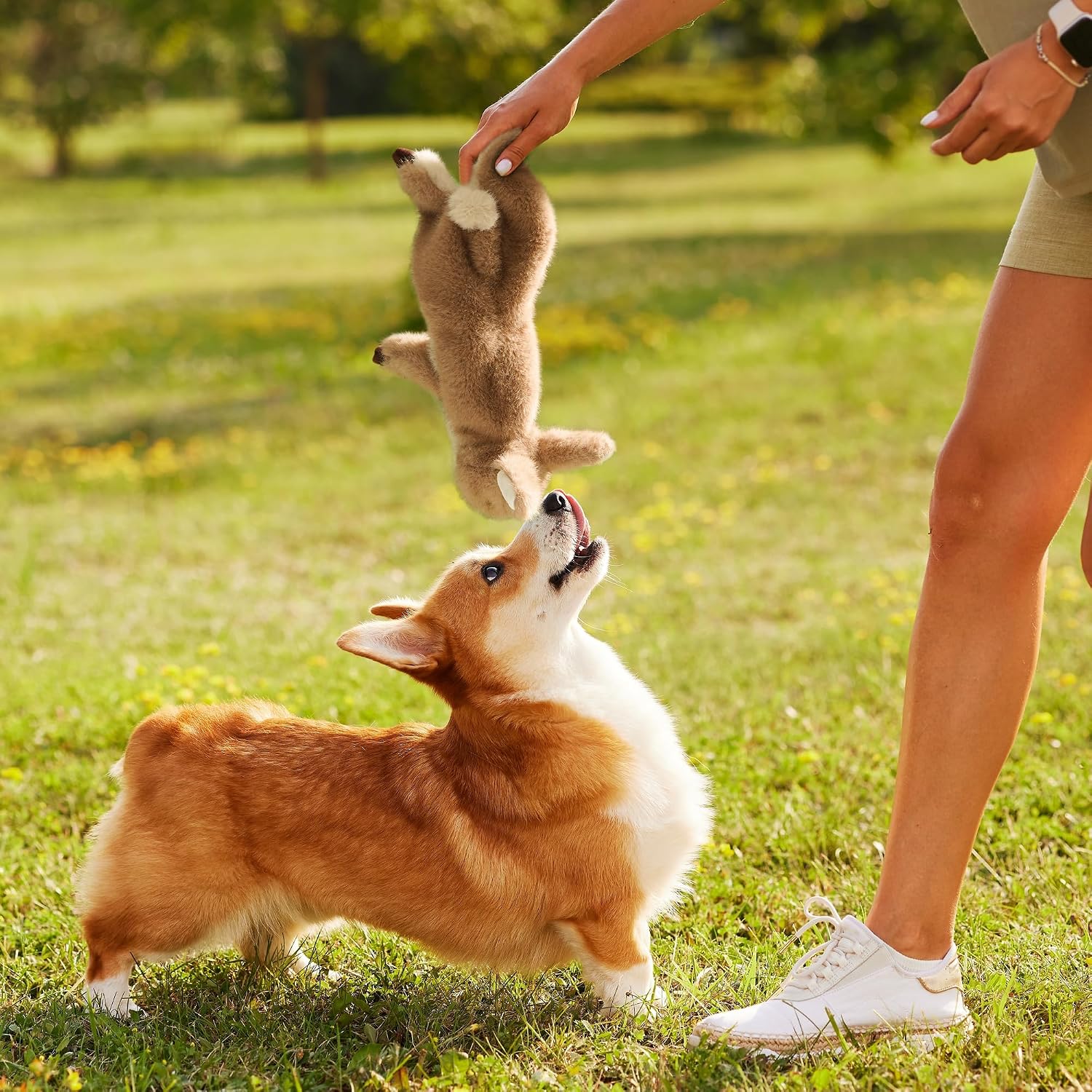 Fuzzwoof bunny toy held by hand to show size