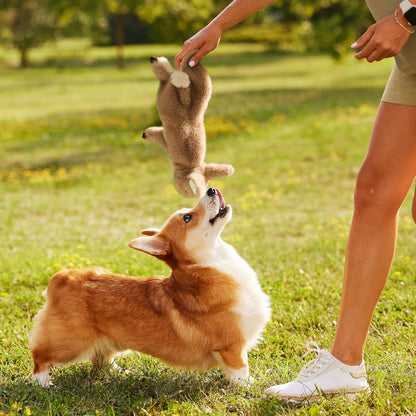 Fuzzwoof bunny toy held by hand to show size