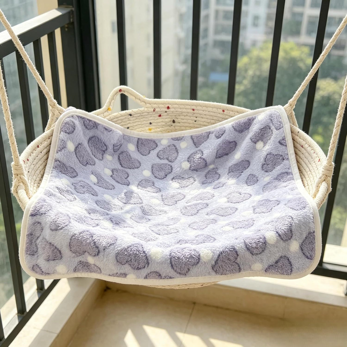 Machine washable dog blanket being placed into a washing machine.