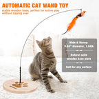 JXFUKAL automatic cat wand toy with interchangeable feather bird and butterfly attachments on the floor.