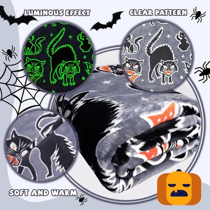 Luminous spooky cat blanket illuminating brightly inside a dark bedroom setting.