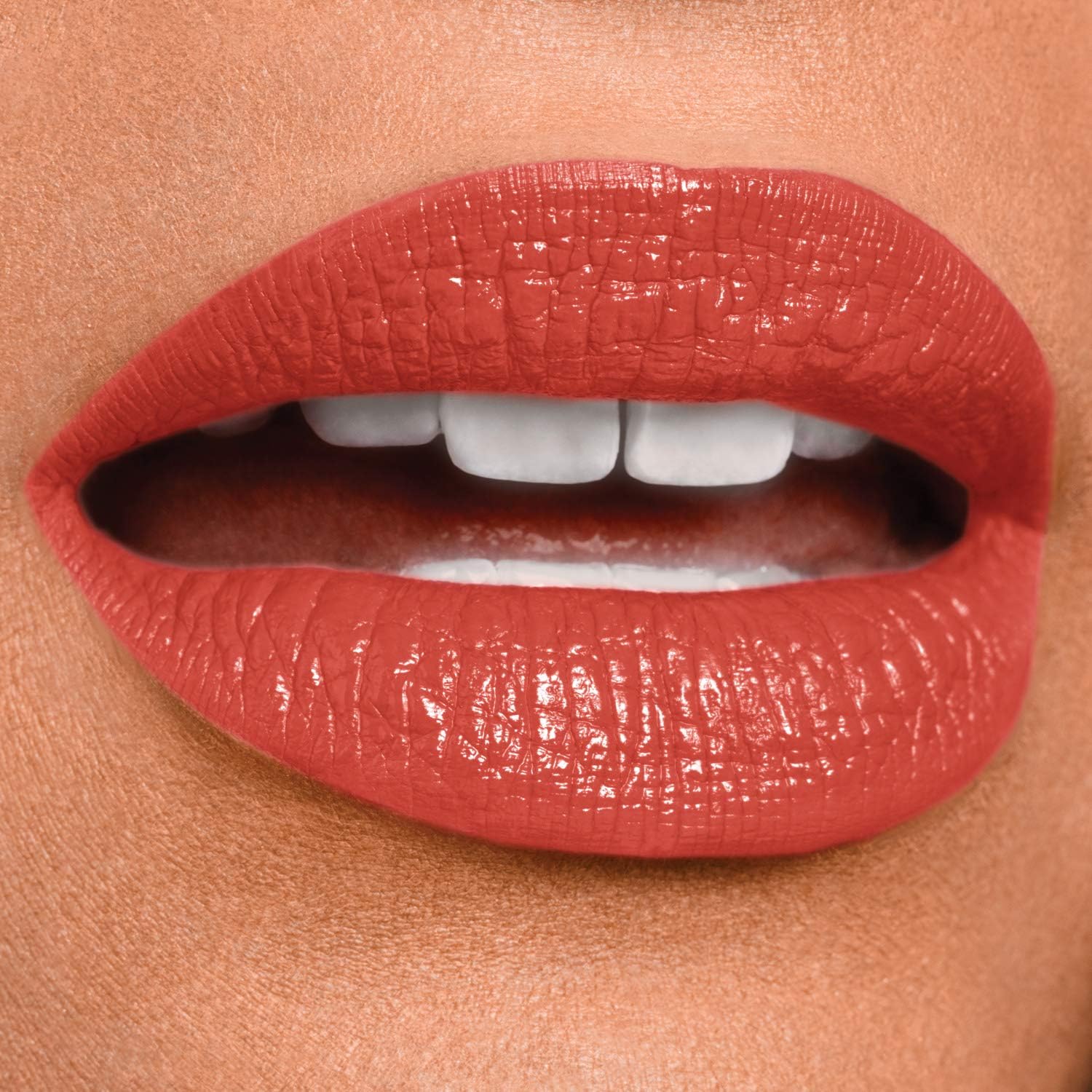 Maybelline Continuous Coral smudge proof lipstick shade swatch on a clean surface.