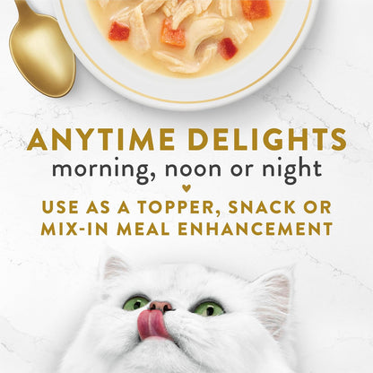 Gourmet wet cat food complement being poured from a pouch showing real chicken pieces.