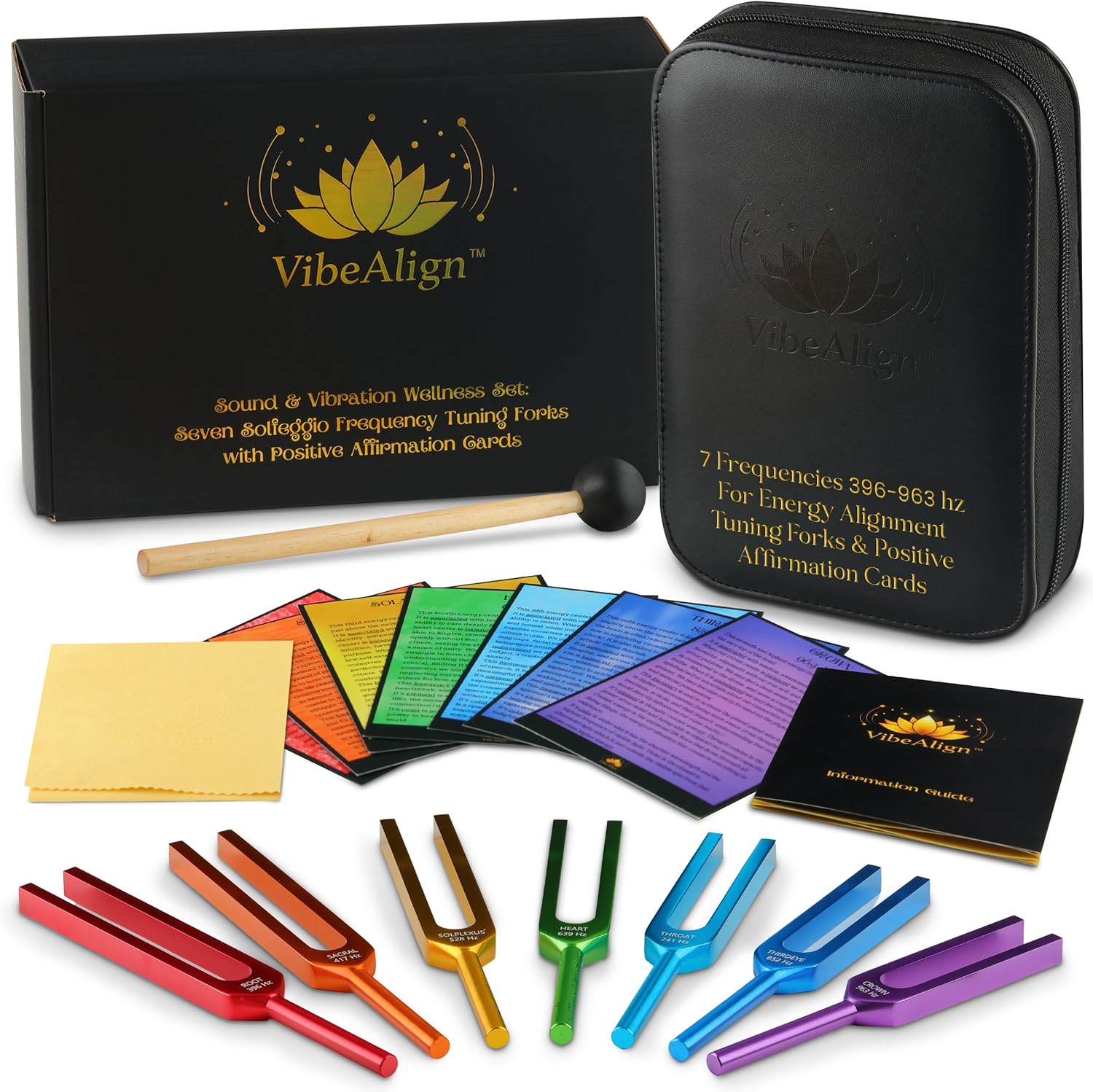 VibeAlign tuning forks set front view showing seven color coded instruments arranged neatly next to affirmation cards.