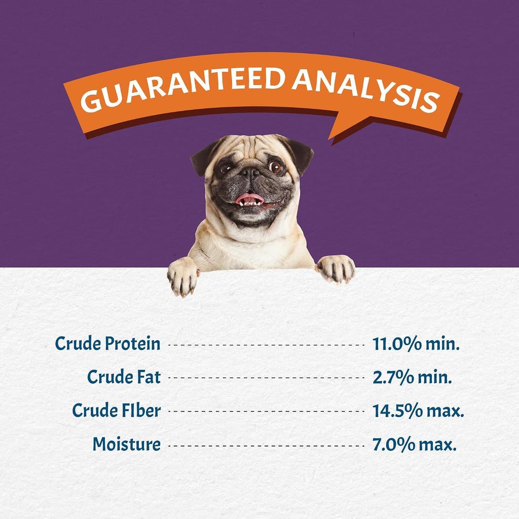 Dog eating meal with Canine Caviar vegetable topper