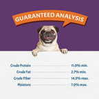 Dog eating meal with Canine Caviar vegetable topper
