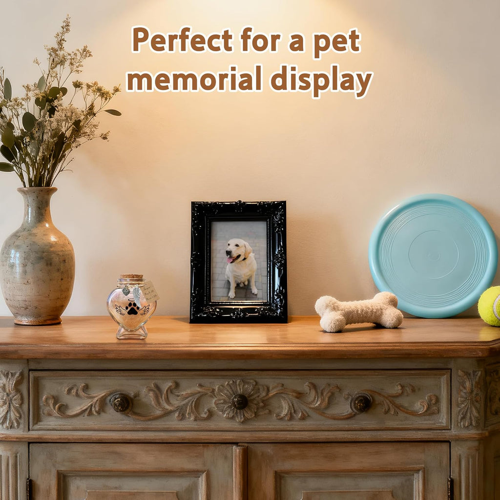 Heart shape glass memory jar filled with a soft tuft of pet fur on a desk