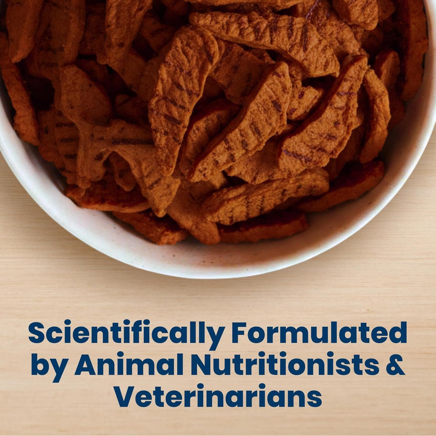 Oven dried USA beef dog snack pieces being broken apart for small pet training sessions.