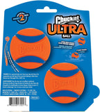 Chuckit! Ultra Ball held next to a medium dog toy launcher.