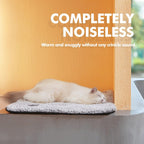 Mora Pets non electric heating mat used by a sleeping kitten on a living room floor