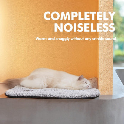 Mora Pets non electric heating mat used by a sleeping kitten on a living room floor