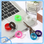 Multi color silicone scissor ring grips display highlighting eight different shades