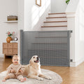Babepai Retractable Baby Gate Extra Wide front view installed at the bottom of a staircase.