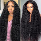 Flwing thirty inch deep wave lace front human hair wig front view showcasing voluminous black curls.