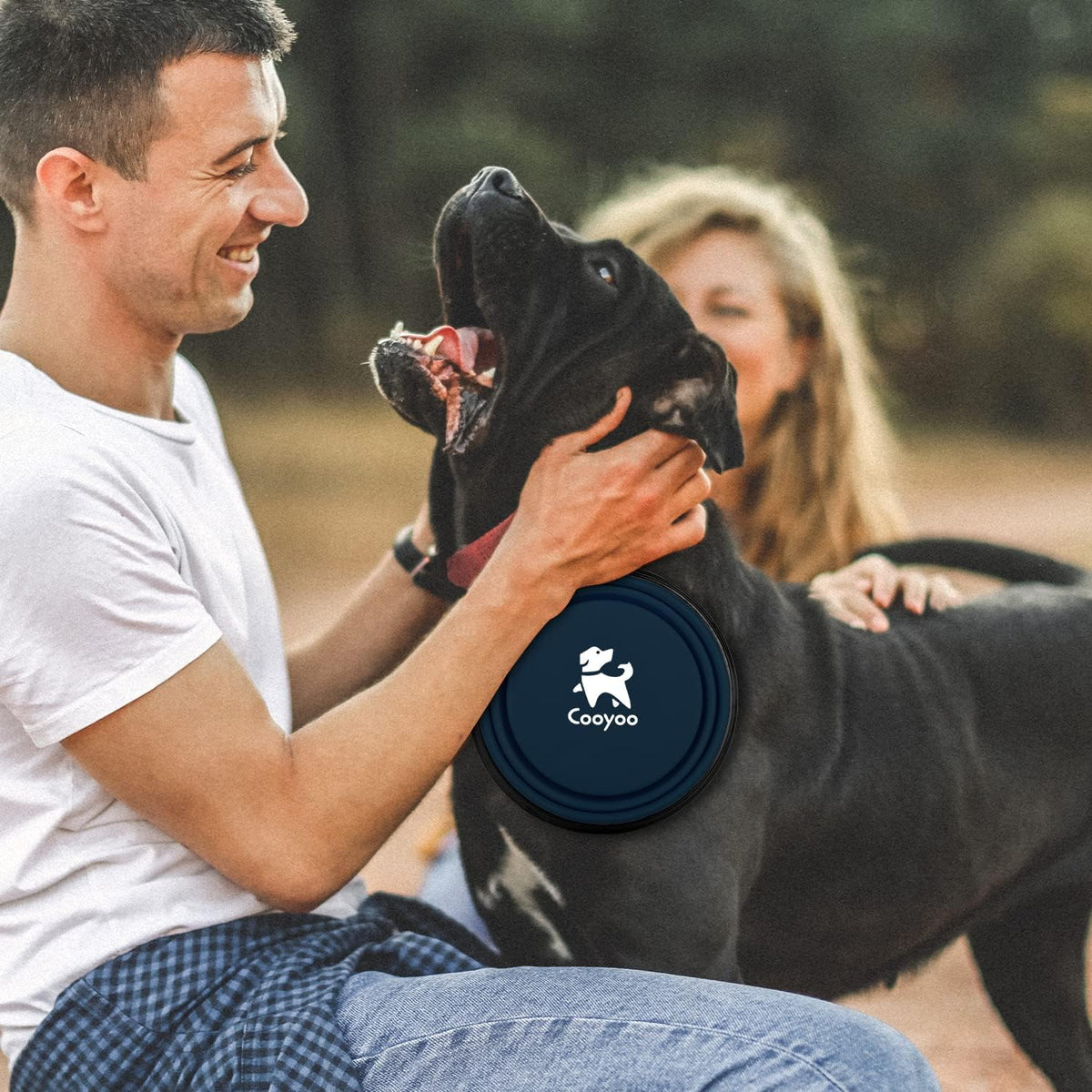 COOYOO lightweight collapsible puppy feeding dish attached to a backpack.
