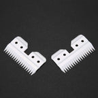Professional grade replacement blades for pet hair clippers displayed on a clean surface.