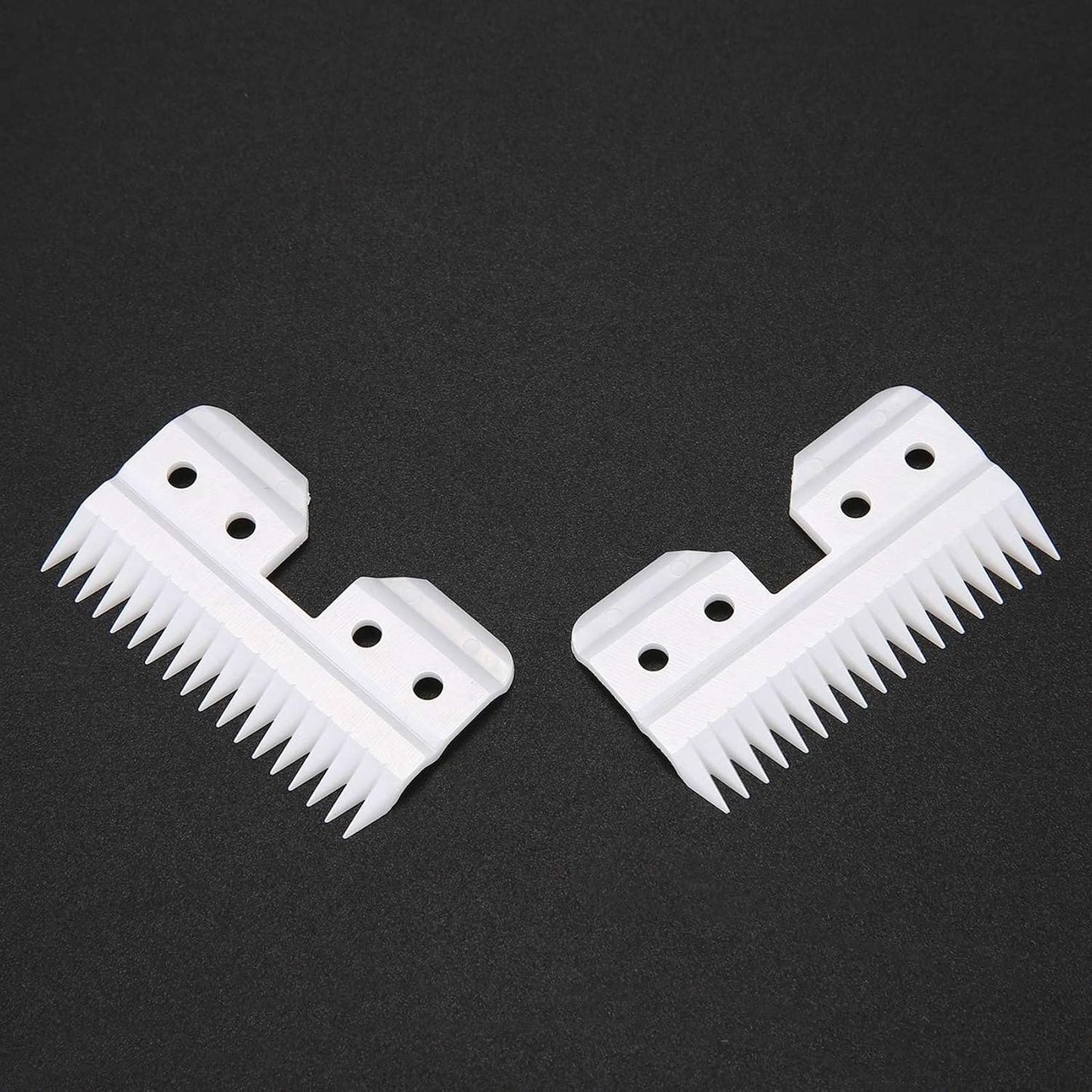 Professional grade replacement blades for pet hair clippers displayed on a clean surface.