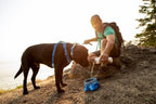 Ruffwear Quencher fabric bowl packed neatly inside a travel backpack pocket