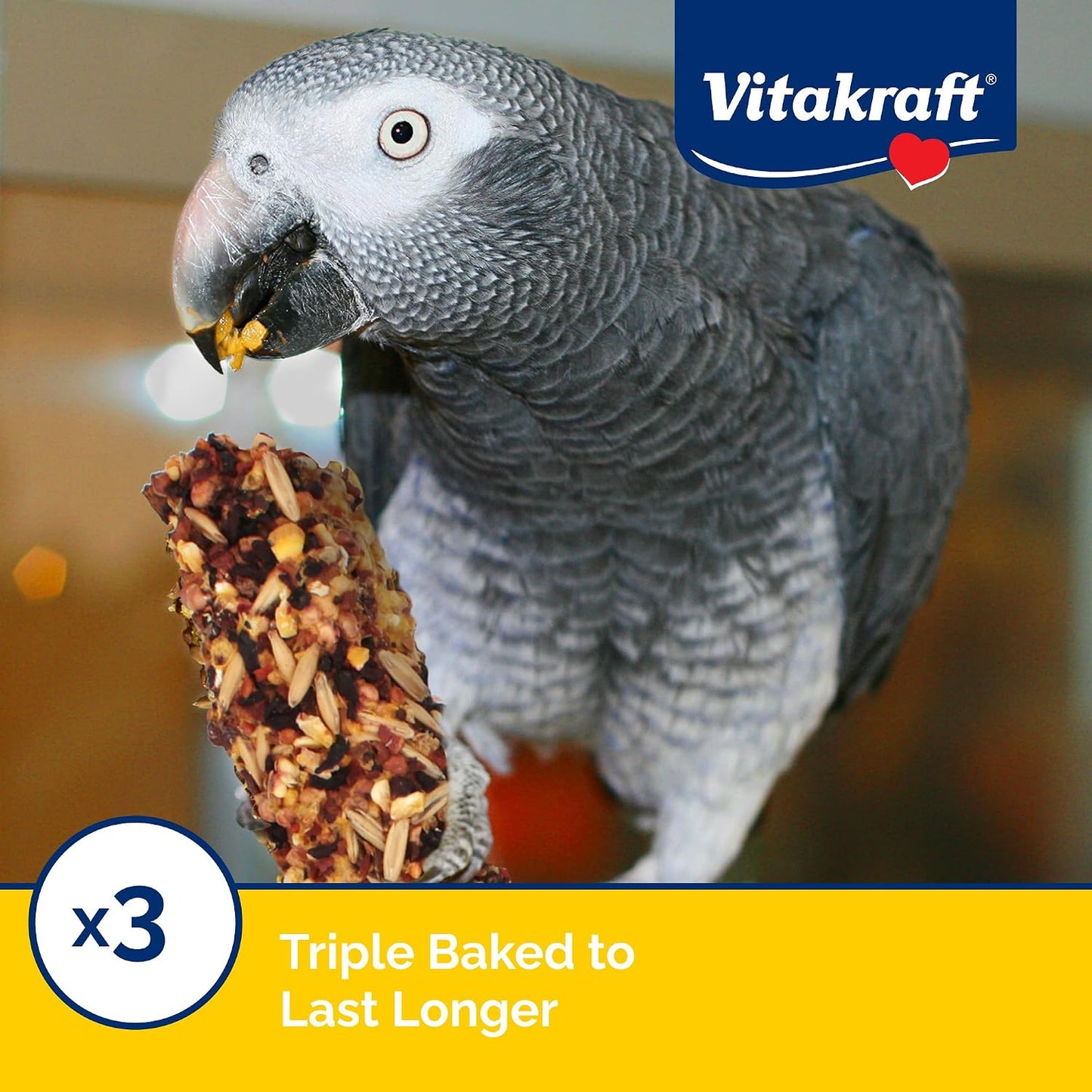 Parrot enjoying Vitakraft crunch sticks in bird cage