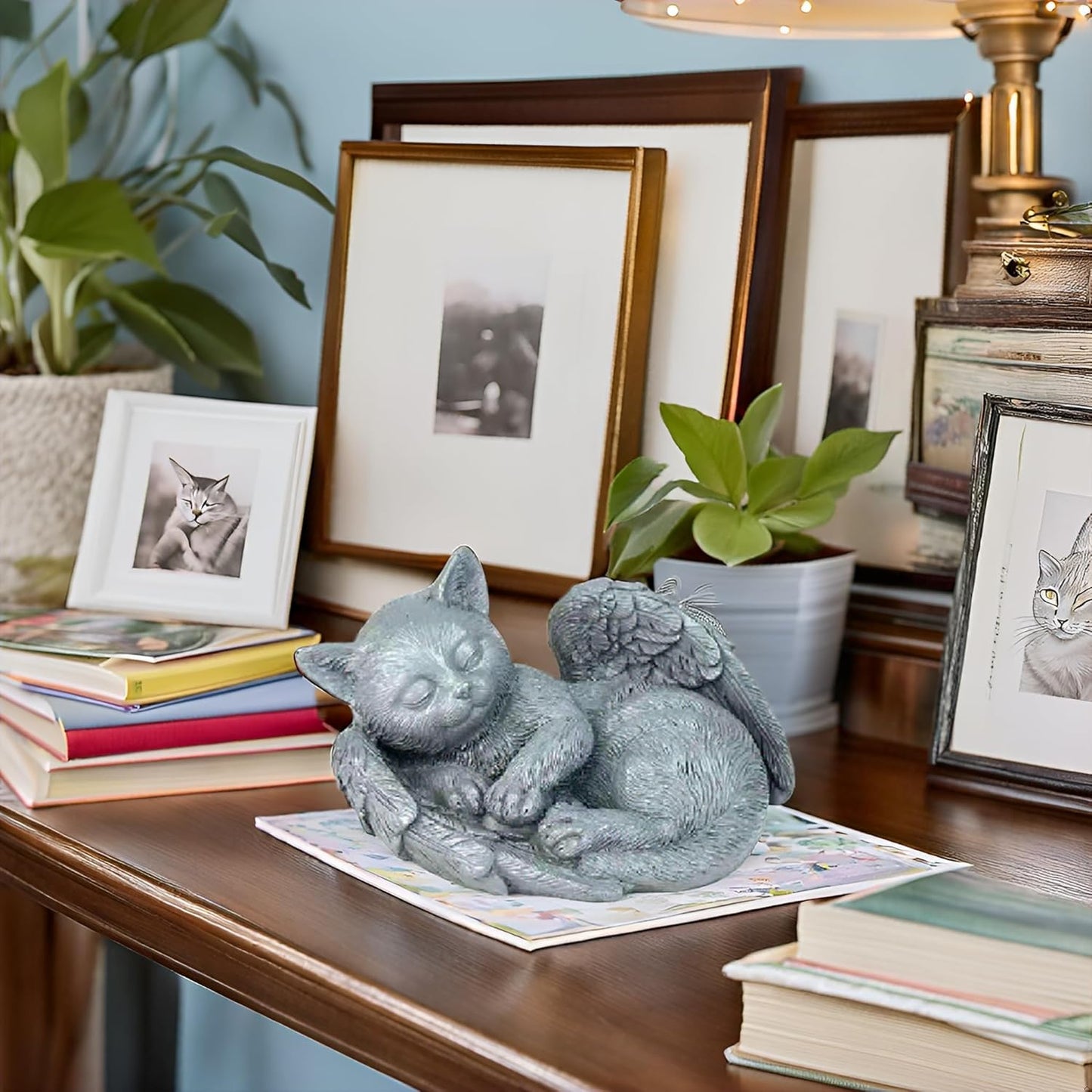 Durable resin cat monument placed near flowers as a backyard pet grave headstone