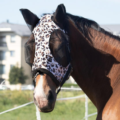 Horse wearing Harrison Howard UV protection fly mask in field