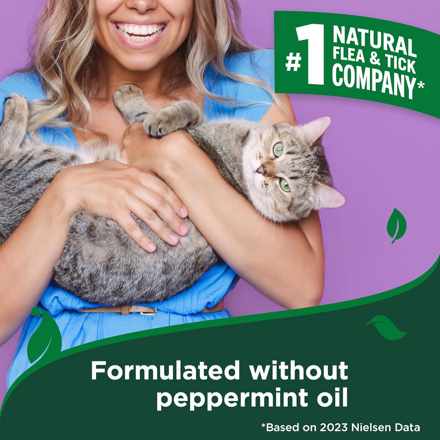 Natural flea and tick spray for cats being applied to household pet bedding.