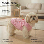Side view of medium dog wearing pink cotton vest
