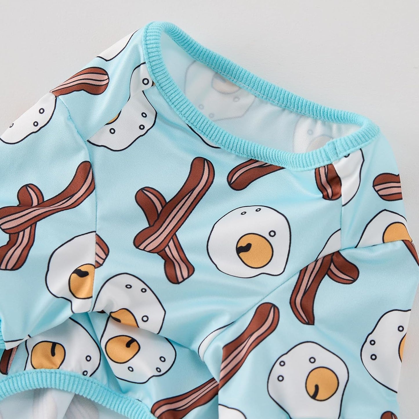 Back view of the light blue CozeVian dog pajamas showing complete tail-to-neck coverage