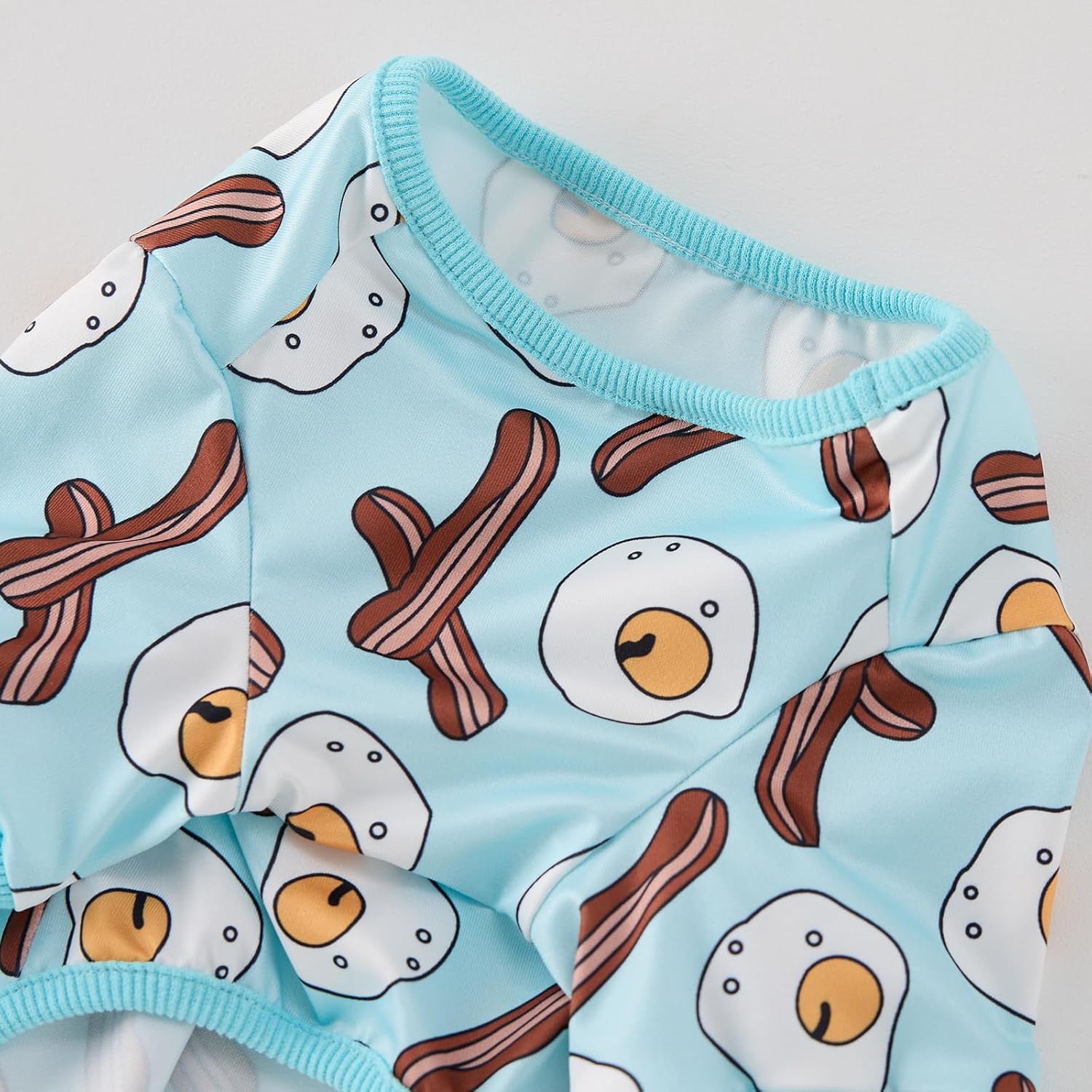 Back view of the light blue CozeVian dog pajamas showing complete tail-to-neck coverage