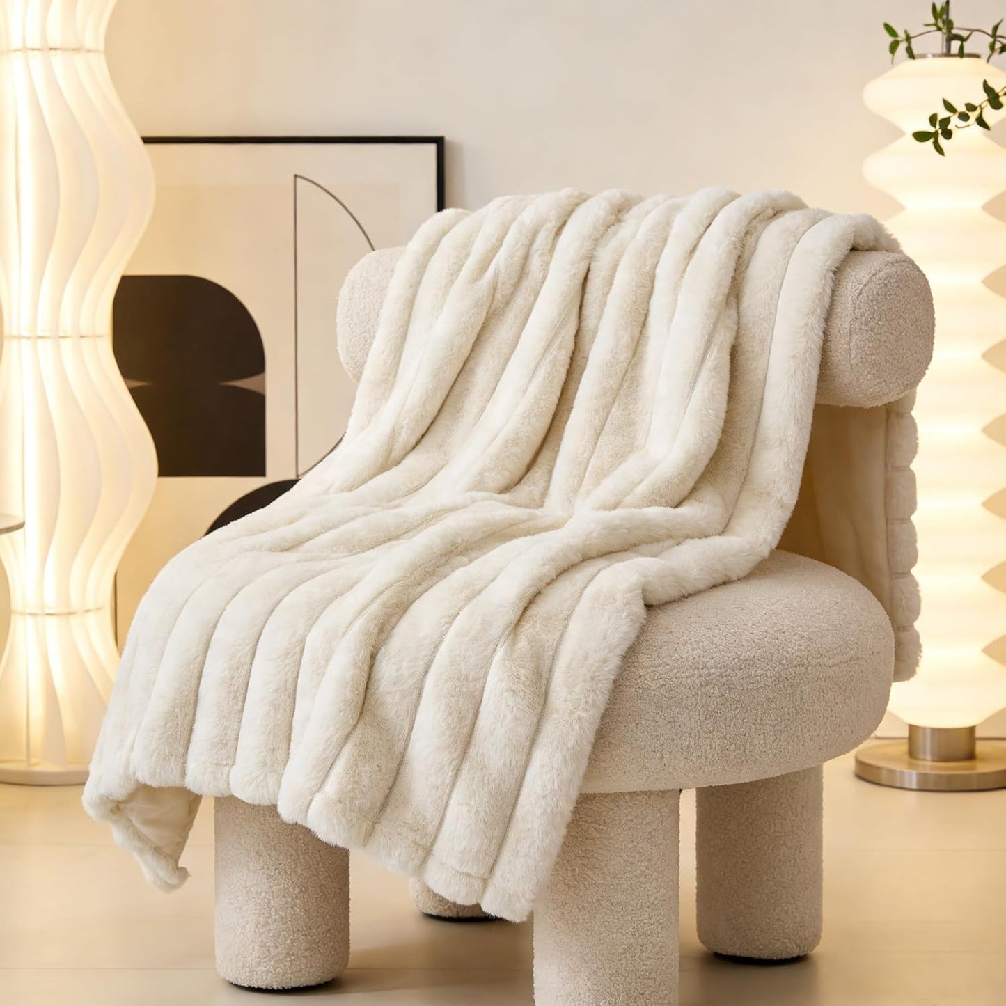 Zakapaws luxury plush dog blanket folded neatly on a white bedroom mattress.