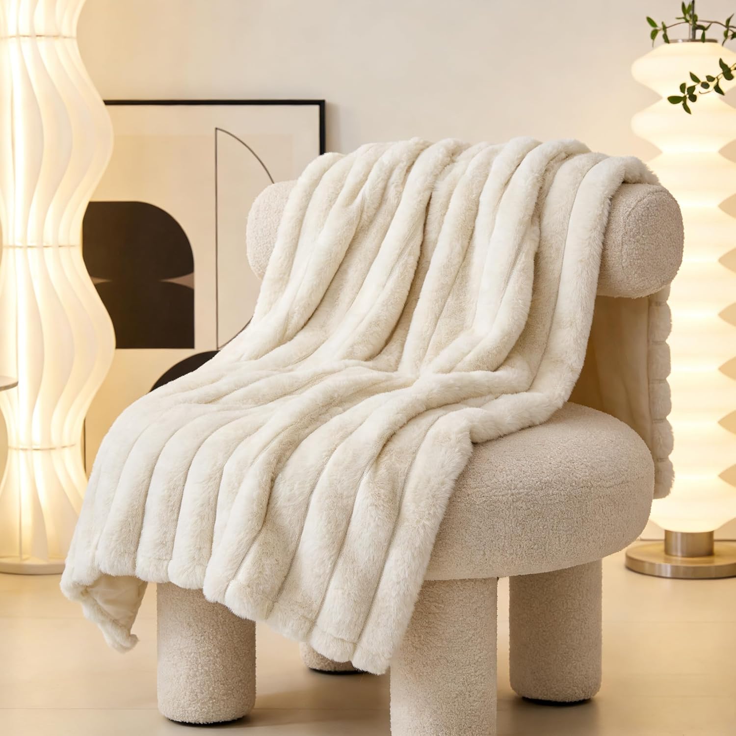 Zakapaws luxury plush dog blanket folded neatly on a white bedroom mattress.