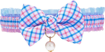 Side view of cat wearing floral tulip bowtie collar