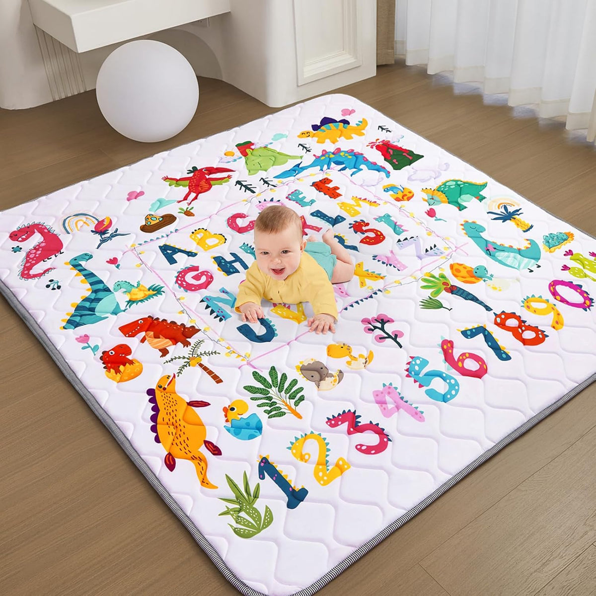 TreeBud baby play mat front view showcasing the dinosaur and alphabet design.