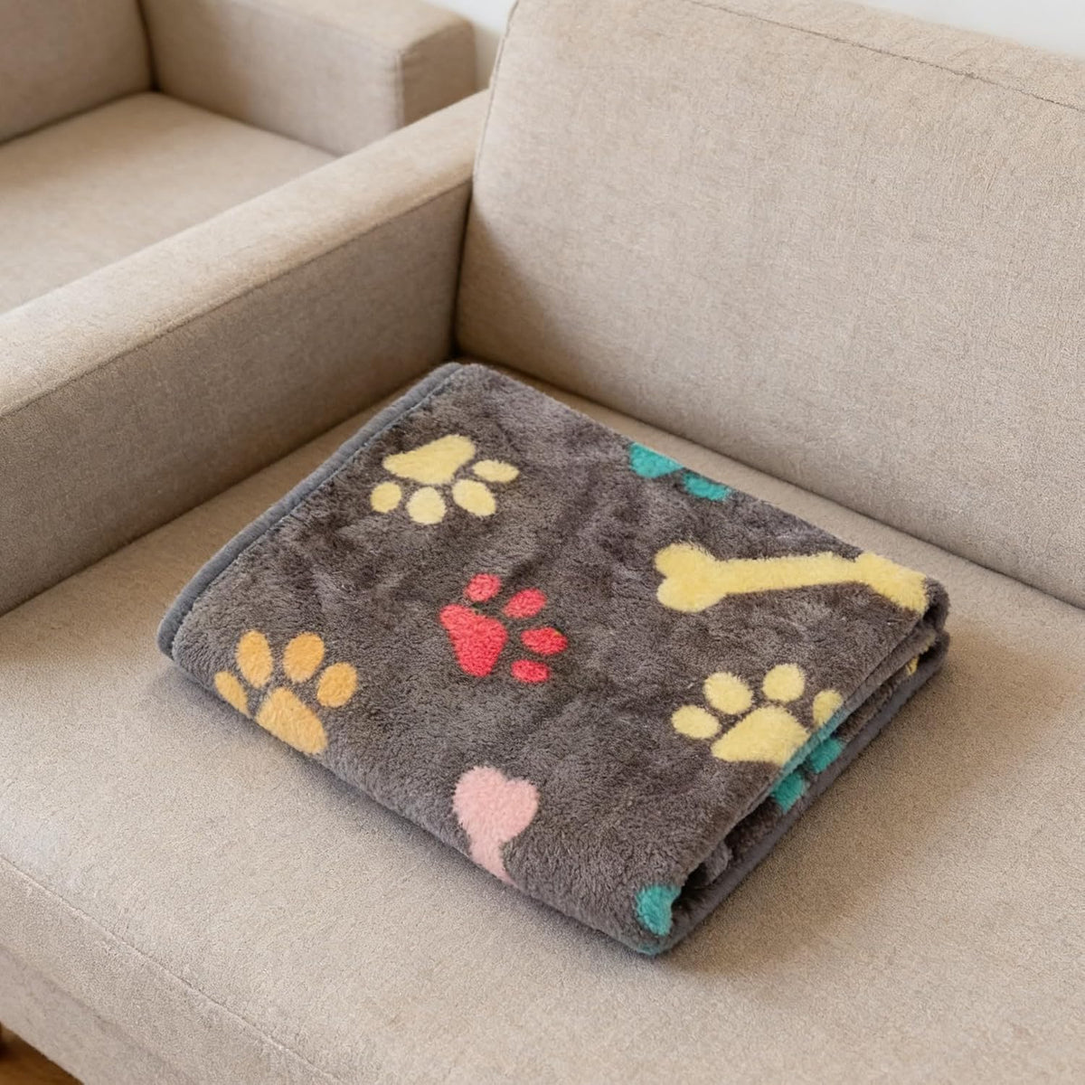 Durable and washable cat blanket fabric texture in soft pink color.