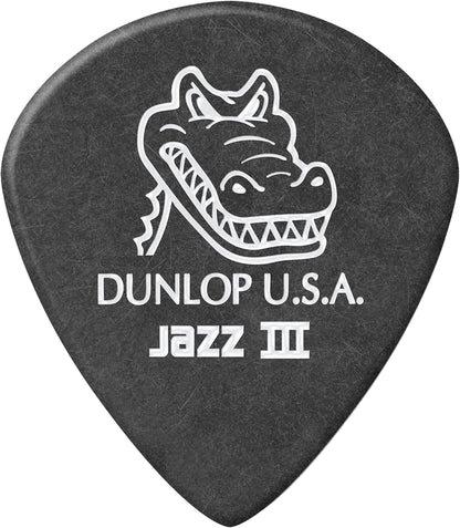 Close up shot highlighting the molded beveled edge profile of the Dunlop 1.4mm guitar pick.