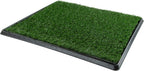 Small dog using Petmaker indoor grass potty mat